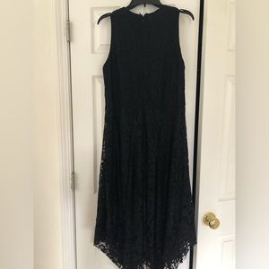 Beautiful black dress with asymmetrical lace cover.